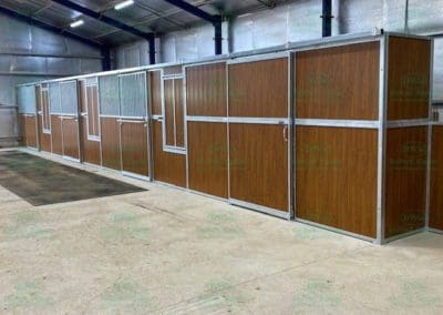 Matching tack room horse stables in timber